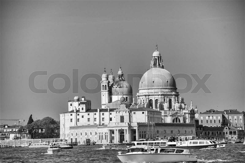 VENICE, ITALY - MAR 23, 2014: City view with landmarks and boats. The city has 21 million visitors each year, stock photo