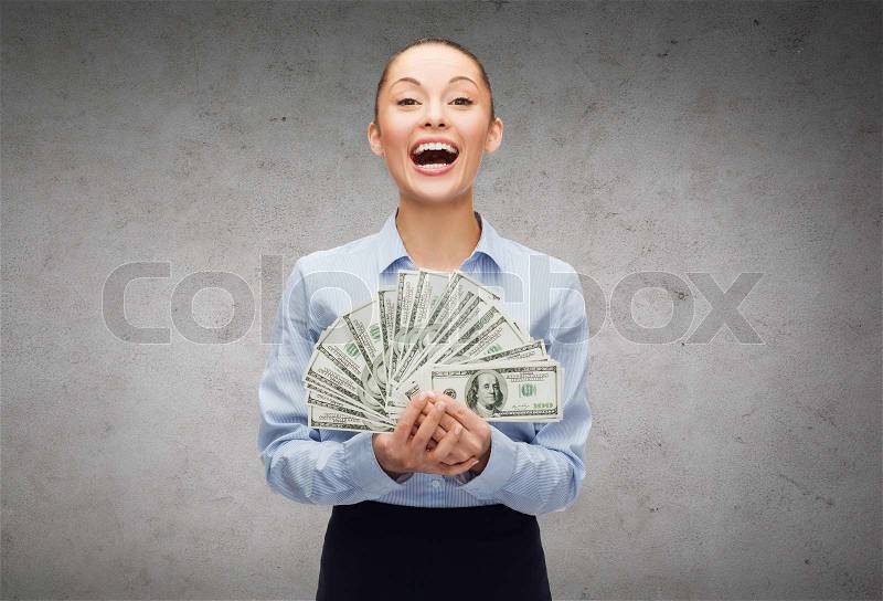 Business and money concept - laughing businesswoman with dollar cash money, stock photo