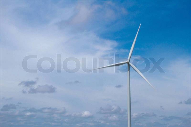 Giant wind turbines in the field to produce electricity , the alternative power from nature , stock photo