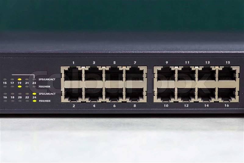 Part of Network switch with 16 ports on the office table, Front view version, stock photo