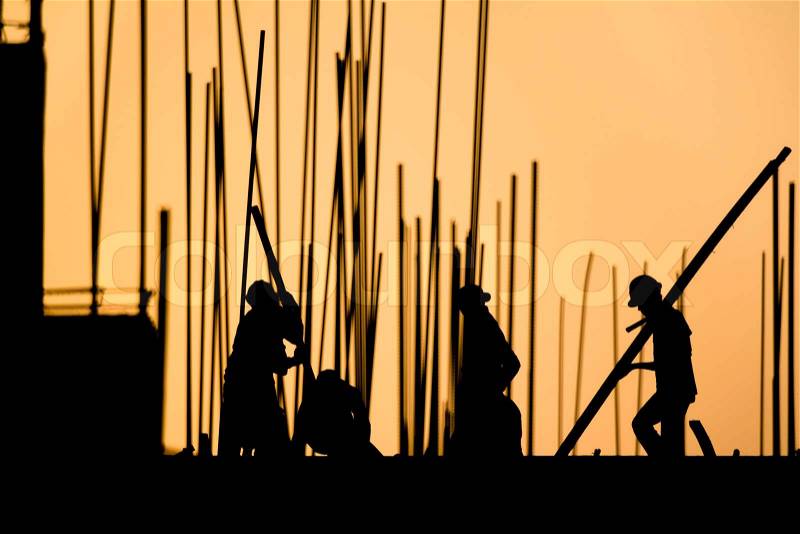 Construction worker silhouette on the work place, stock photo