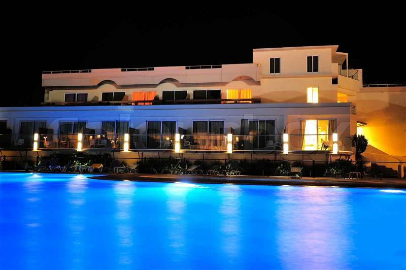 Night pool side of rich hotel, stock photo