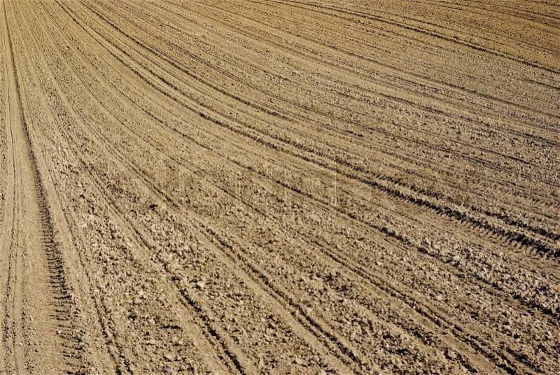Plowed land on the field during agricultural work, stock photo