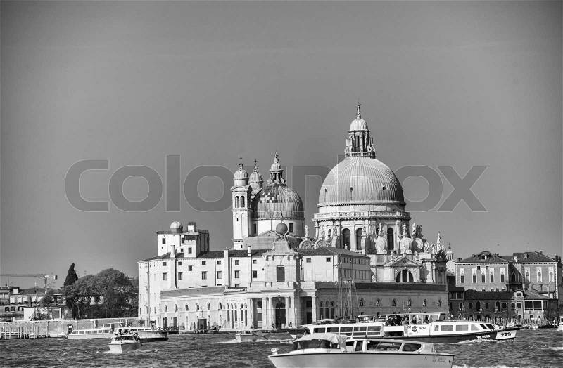 VENICE, ITALY - MAR 23, 2014: City view with landmarks and boats. The city has 21 million visitors each year, stock photo