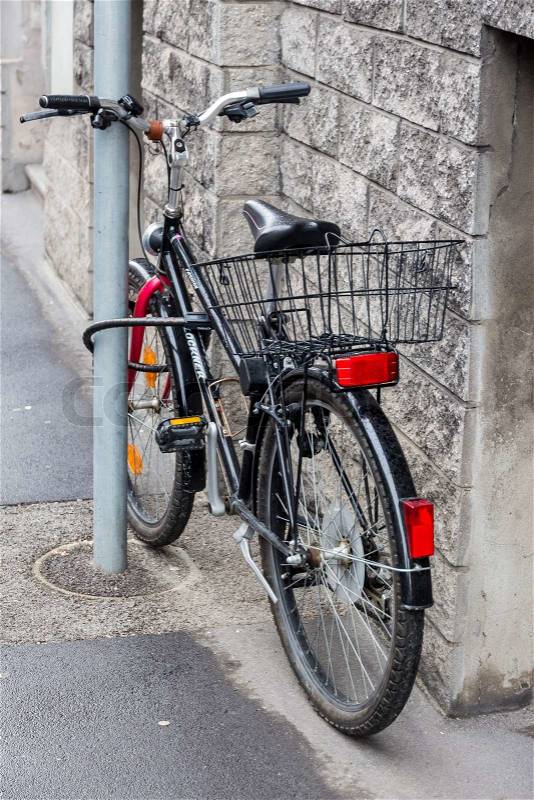 A bicycle was taken firmly to prevent the theft on a pole. bicycle lock against theft lock, stock photo