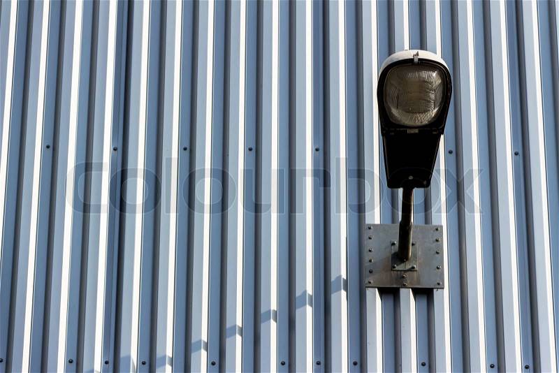 A street lighting on an industrial building. light and shadow, stock photo