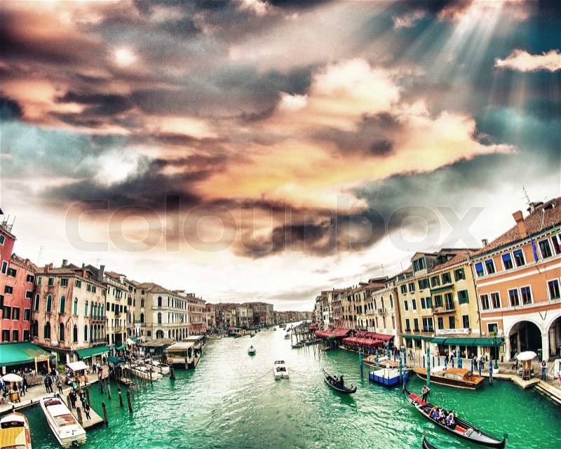 Grand Canal with Venice cityscape and tourists. All recognizable faces blurred, stock photo