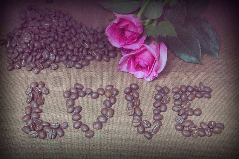 Love coffee beans text and pink rose with vintage filter effect, stock photo