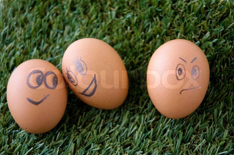 Envy egg face with happy couple faces eggs, stock photo