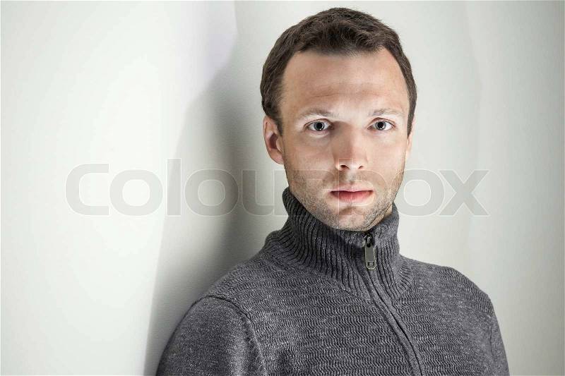 Portrait of young handsome Caucasian man on white background, stock photo