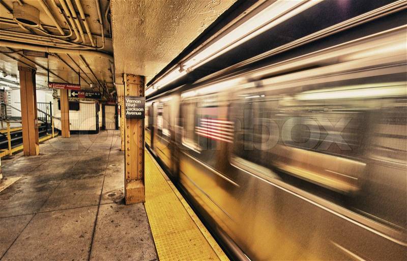 Subway train speeding up in New York City underground system, stock photo