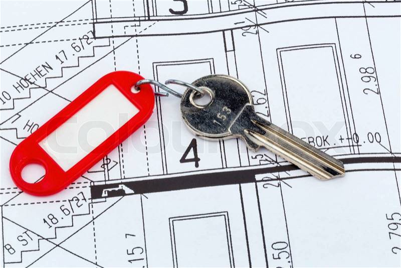 An architect\'s blueprint with the key of an apartment or a new house, stock photo