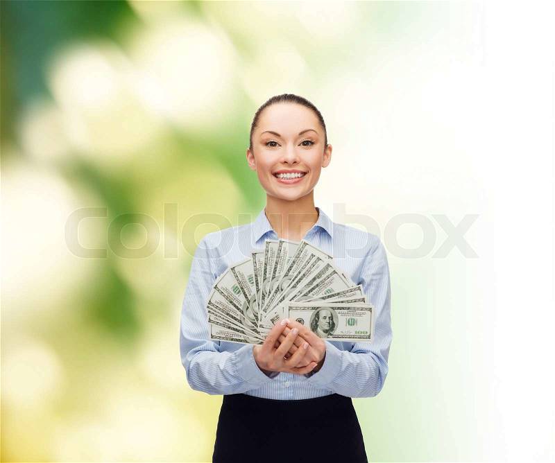 Business and money concept - young businesswoman with dollar cash money, stock photo