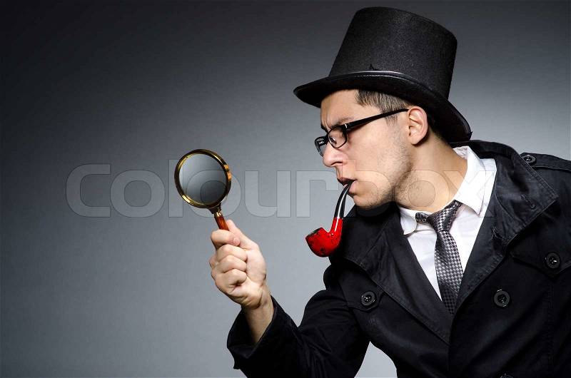 Funny detective with pipe and hat, stock photo