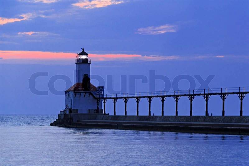 Sundown at the East Pierhead LIght at Michigan City, Indiana on Lake Michigan, stock photo