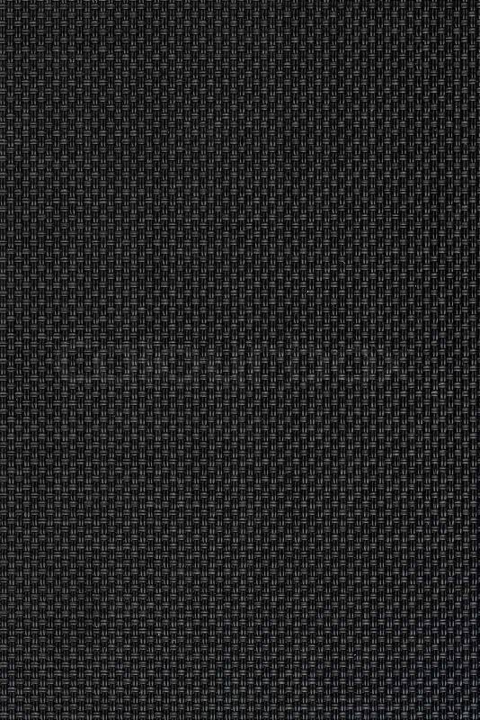 Closeup detail of background made of a black fabric texture, stock photo