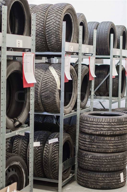 Used old car tires at warehouse, stock photo
