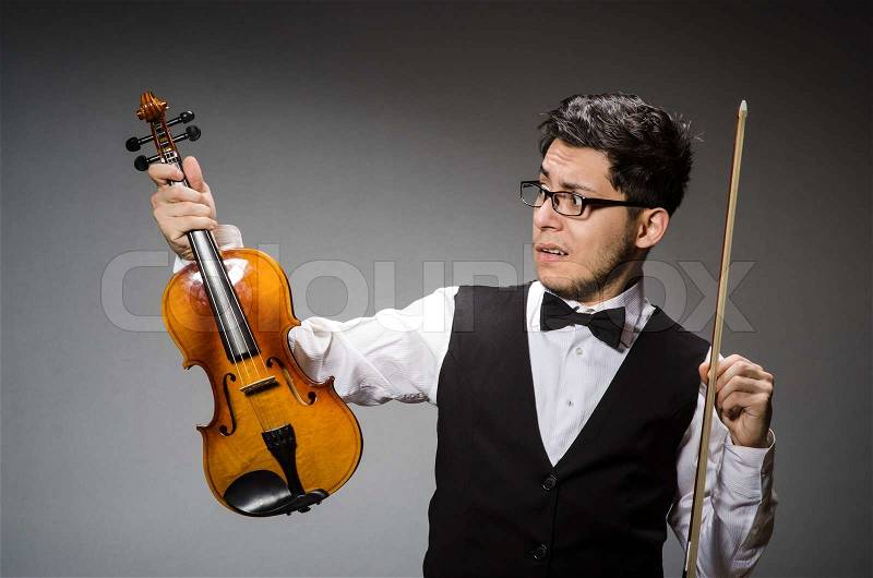 Funny violin player with fiddle, stock photo