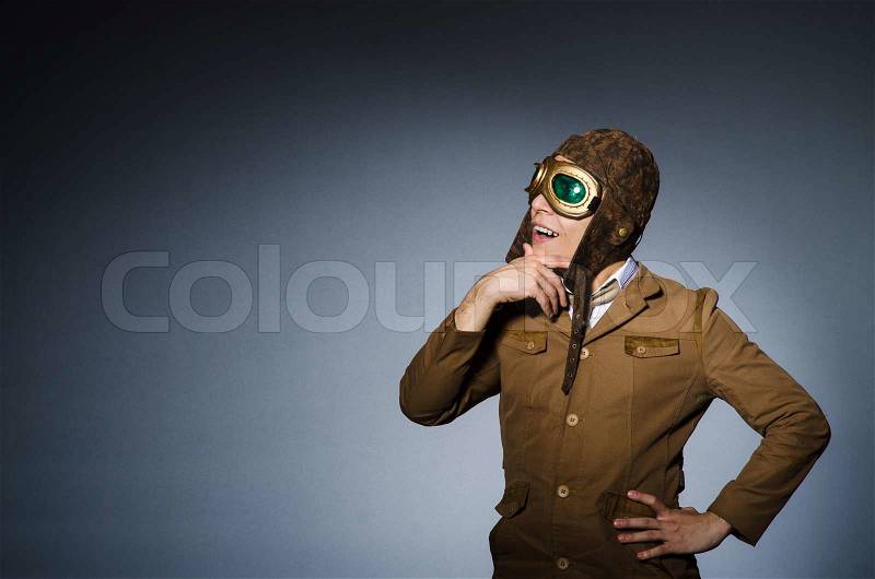 Funny pilot with goggles and helmet, stock photo