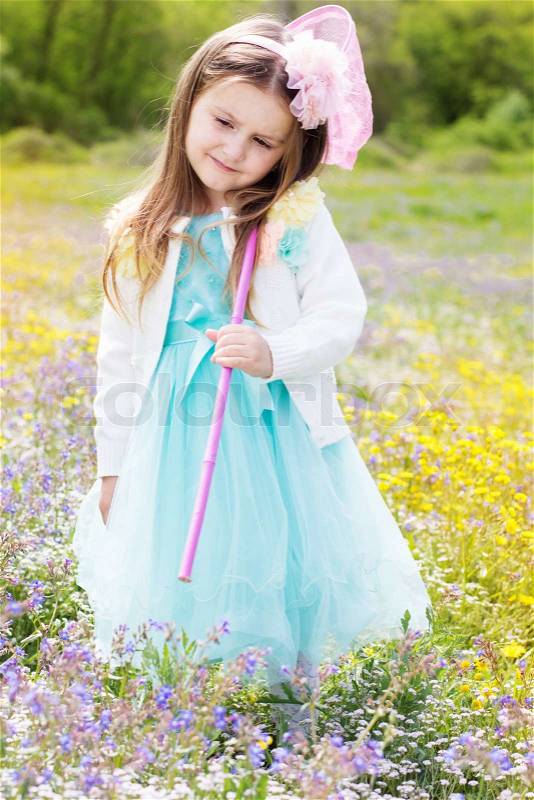 Little girl with butterfly net on the nature, stock photo