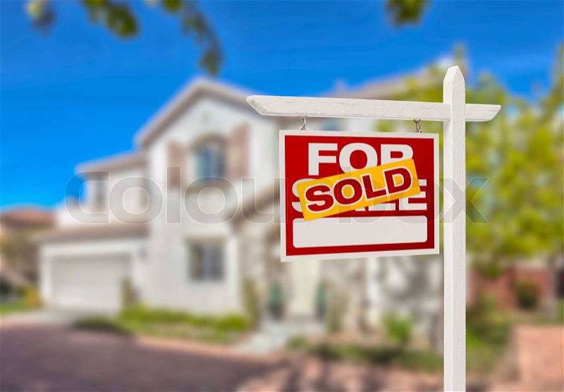 Sold Home For Sale Real Estate Sign in Front of Beautiful New House, stock photo