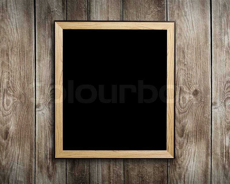 Vintage wooden frame on wood background, stock photo