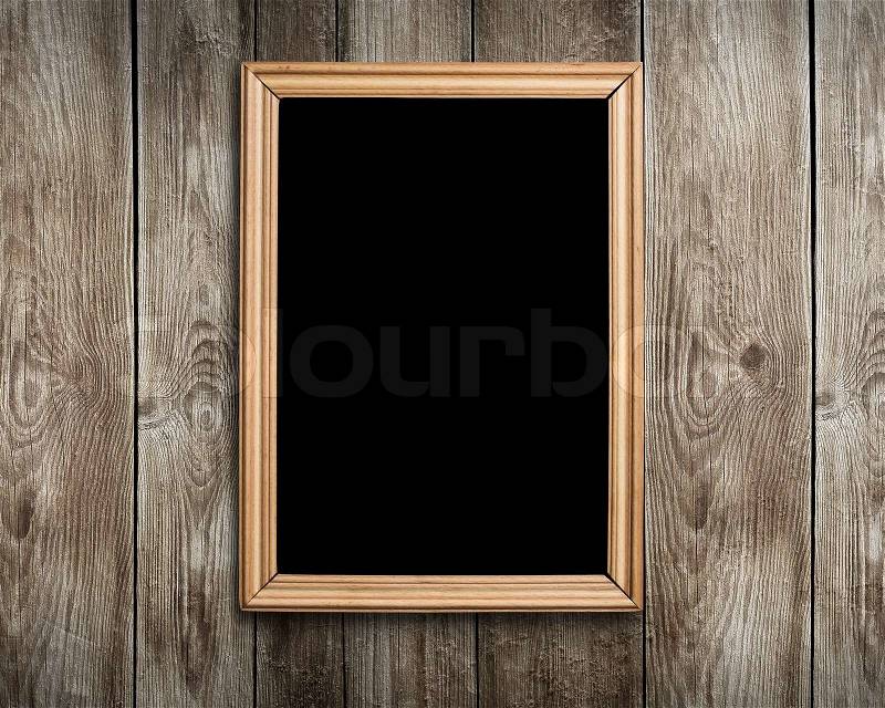 Vintage wooden frame on wood background, stock photo