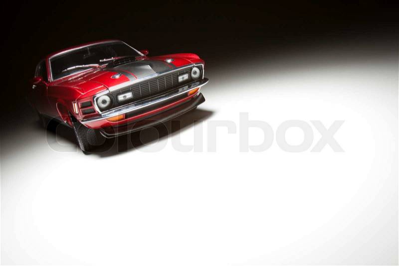 Muscle Sports Car on White Under Spot Light, stock photo