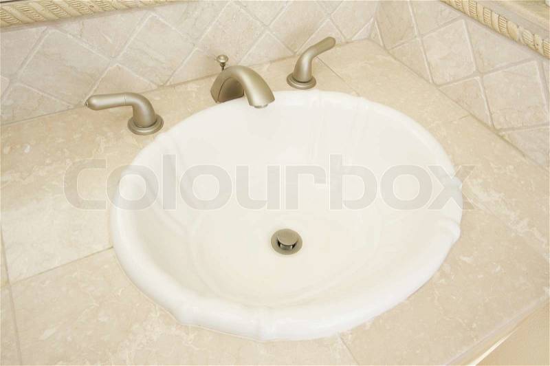 Shell Shaped Sink and Faucet and Tile Counter, stock photo