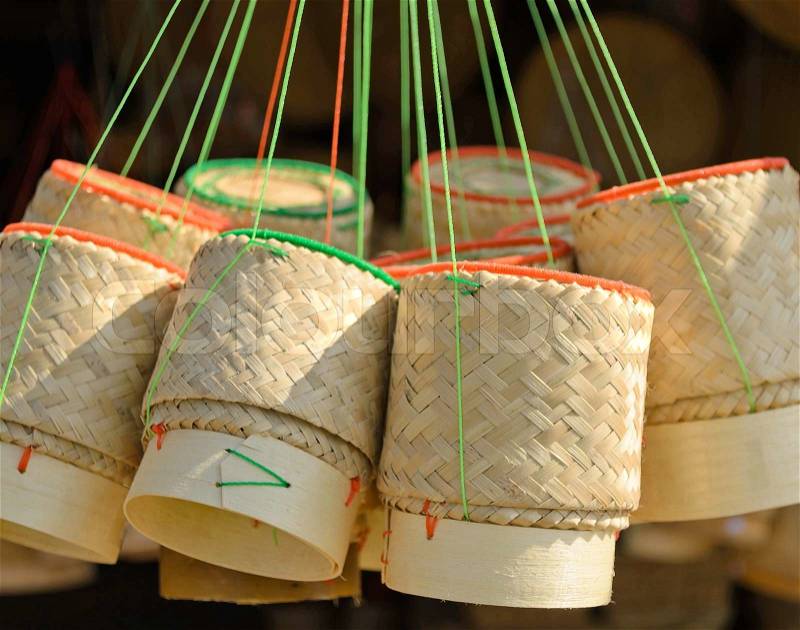 The thai handmade container of cooked glutinous/sticky rice made from bamboo.It use in most northeast of Thailand, stock photo