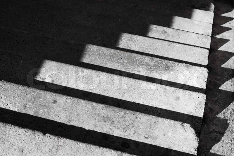 Abstract architecture background with concrete staircase and shadow, stock photo