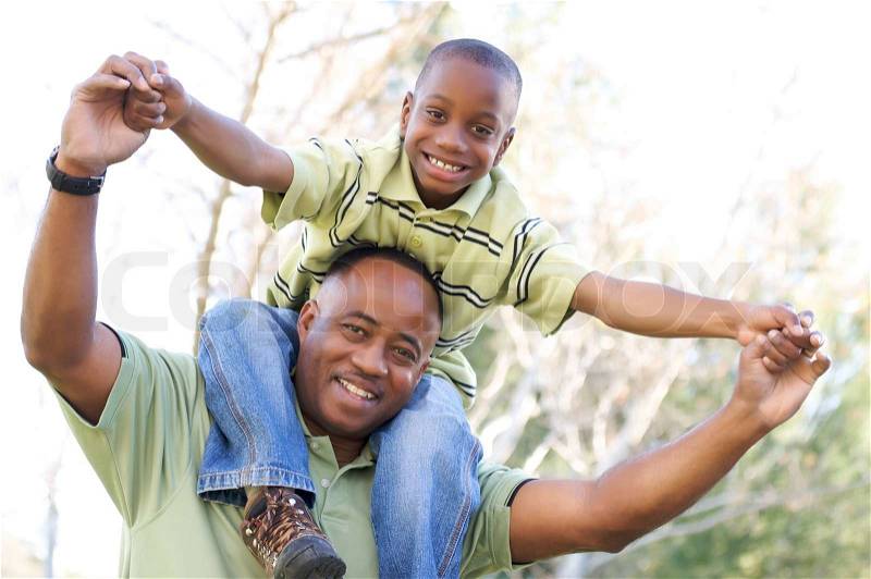 Man and Child Having fun in the park, stock photo