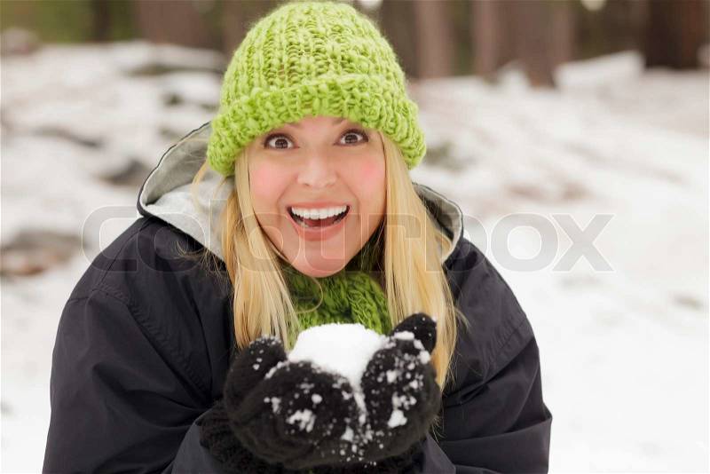 Attractive Woman Having Fun in the Snow on a Winter Day, stock photo