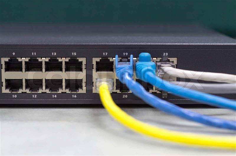 Part of Network switch with LAN cable on the office table, Front view version, stock photo