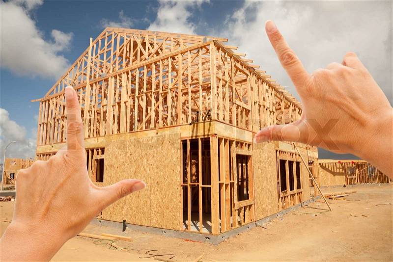 Female Hands Framing New Home Frame on Construction Site, stock photo