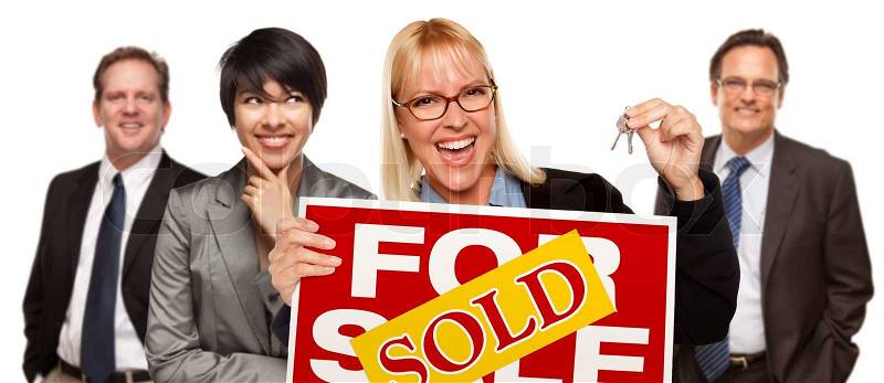 Real Estate Team Behind with Blonde Woman in Front Holding Keys and Sold For Sale Real Estate Sign Isolated on a White Background, stock photo