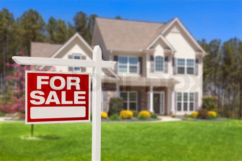 Home For Sale Real Estate Sign and Beautiful New House, stock photo