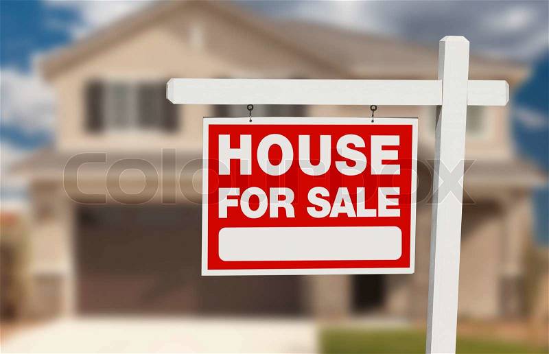 House For Sale Real Estate Sign in Front of Beautiful New Home, stock photo