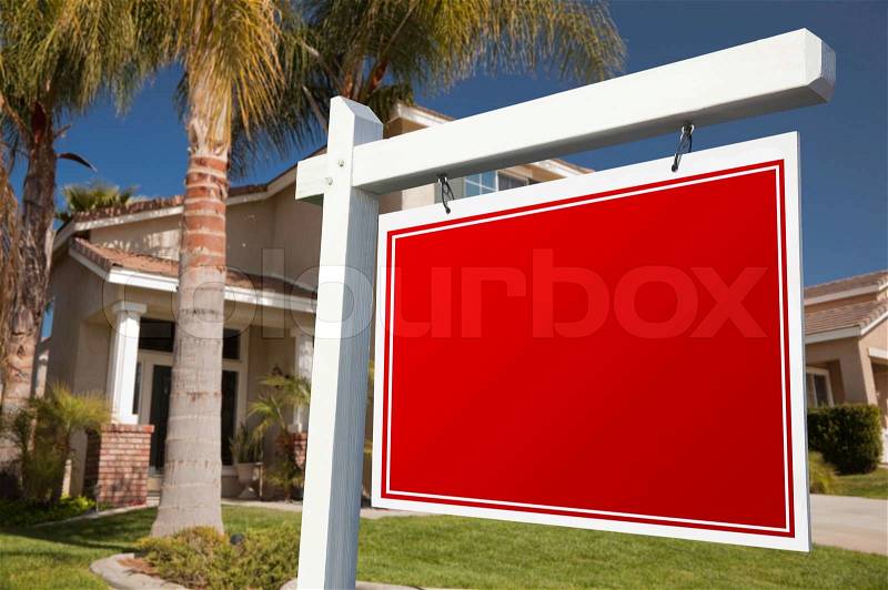 Blank Real Estate Sign in Front of House, stock photo