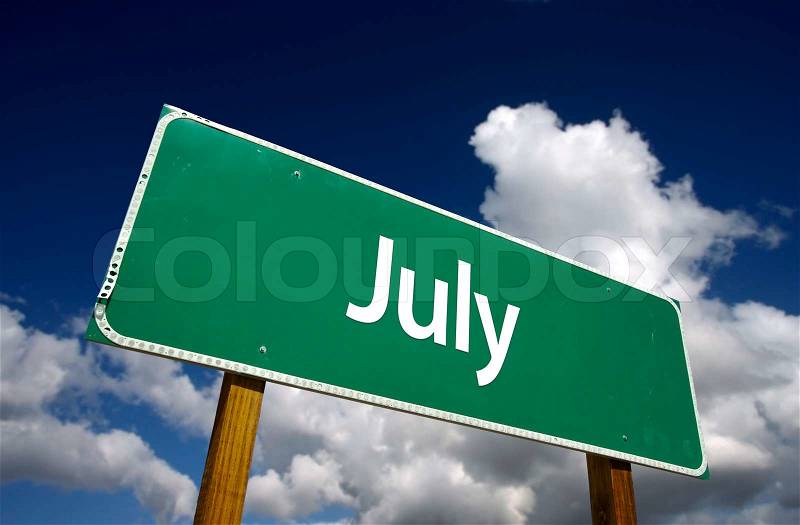 July Green Road Sign with dramatic blue sky and clouds - Months of the Year Series, stock photo