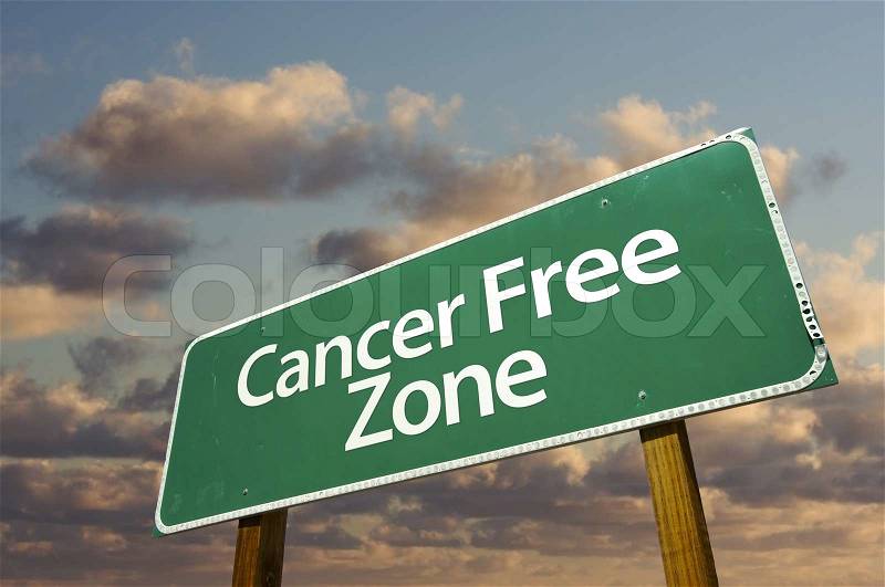 Cancer Free Zone Green Road Sign In Front of Dramatic Clouds and Sky, stock photo