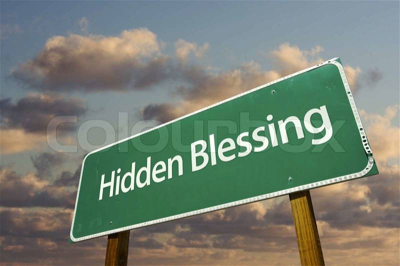 Hidden Blessing Green Road Sign with Dramatic Clouds and Sky. , stock photo