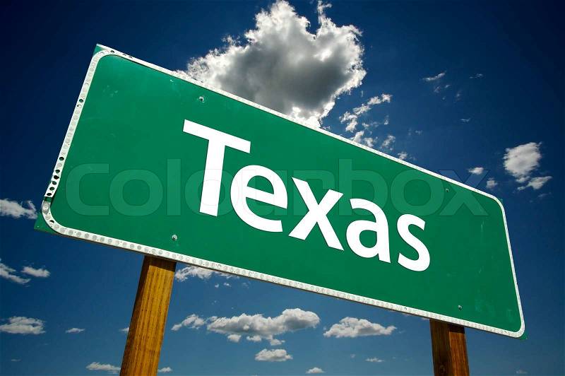 Texas Road Sign with dramatic clouds and sky, stock photo