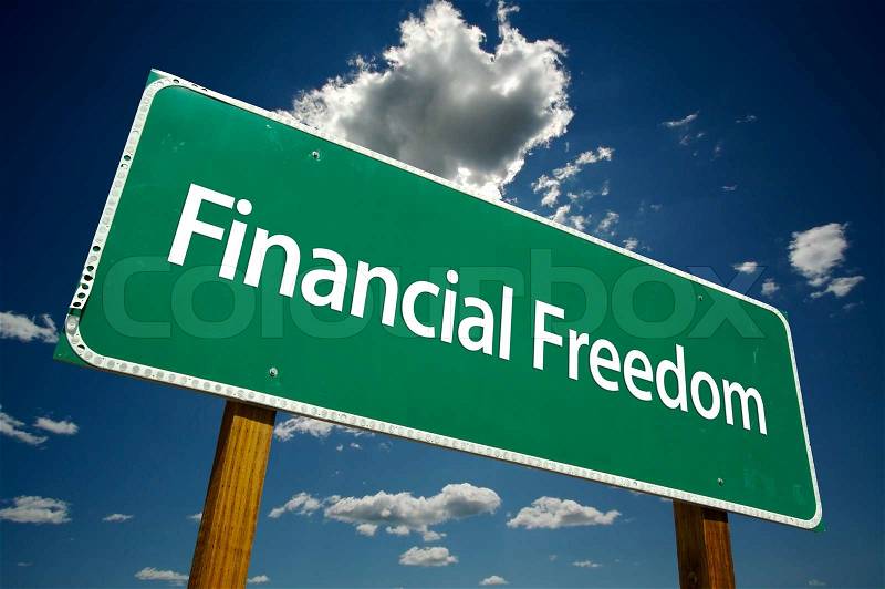 Financial Freedom Road Sign with dramatic clouds and sky, stock photo