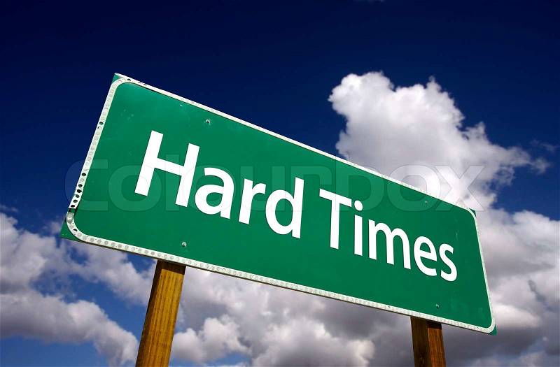 Hard Times Road Sign with Dramatic Clouds and Sky, stock photo