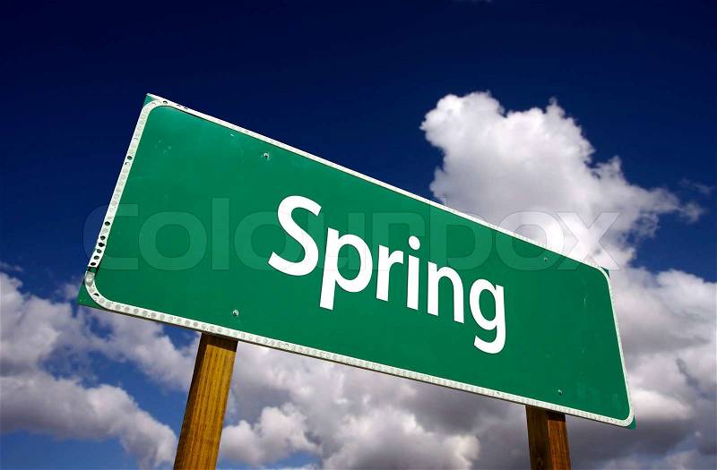 Spring Road Sign with Dramatic Clouds and Sky, stock photo