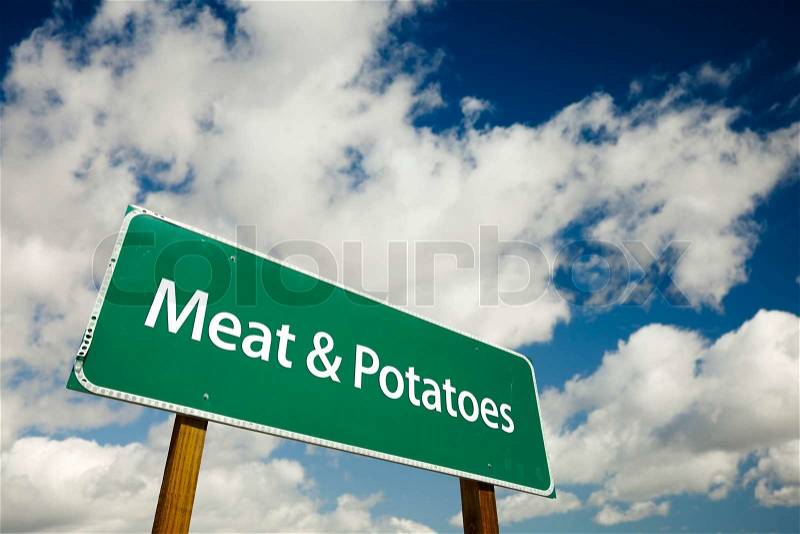 Meat and Potatoes Road Sign with dramatic clouds and sky, stock photo