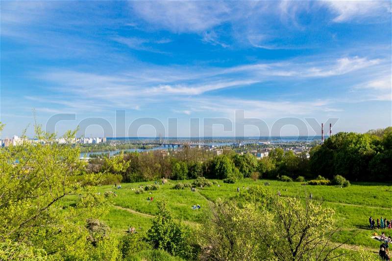 Panorama of city landscape and nature. Kiev, Ukraine. Green trees, architecture, and blue river, stock photo