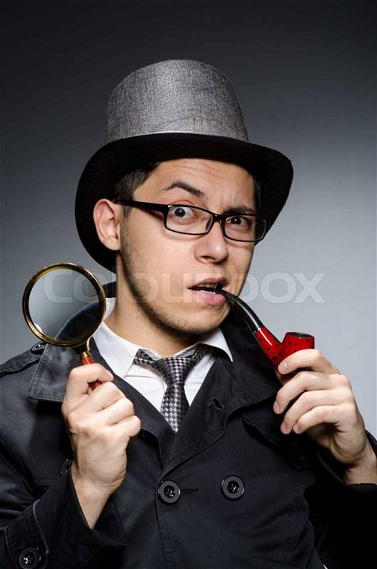 Funny detective with pipe and hat, stock photo