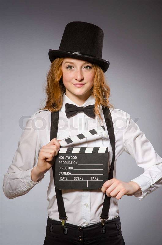 Young woman with movie board , stock photo